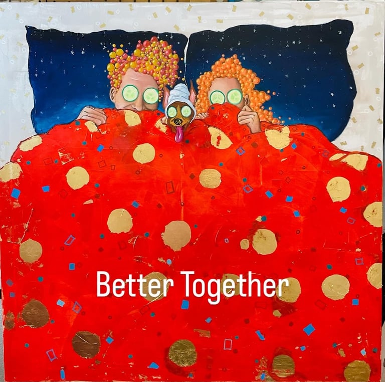 Three cartoon characters with orange afro hair and wide eyes nestled in a large red polka-dotted blanket under a starry night sky