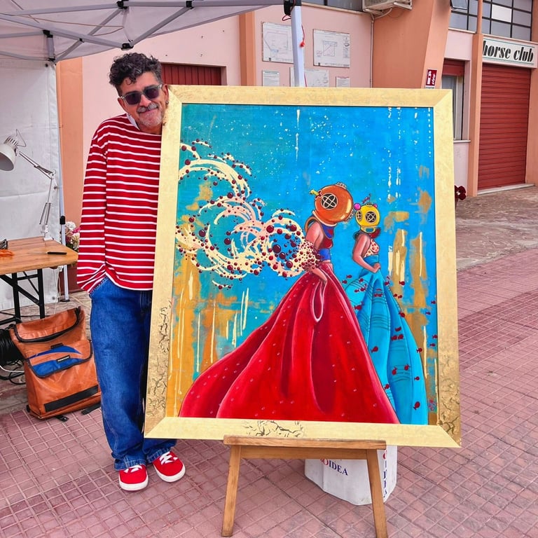 Artist in red striped shirt standing next to colorful painting on easel featuring woman in red dress with blue background