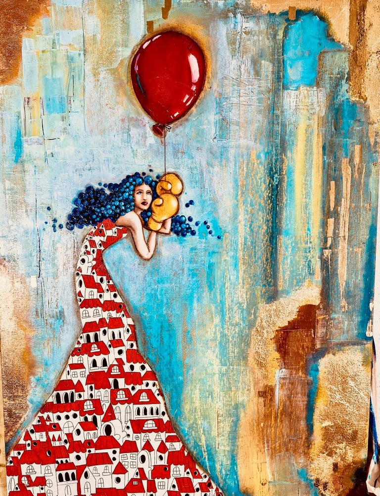Whimsical street art of a figure in red dress with blue curly hair holding a red balloon against weathered wall